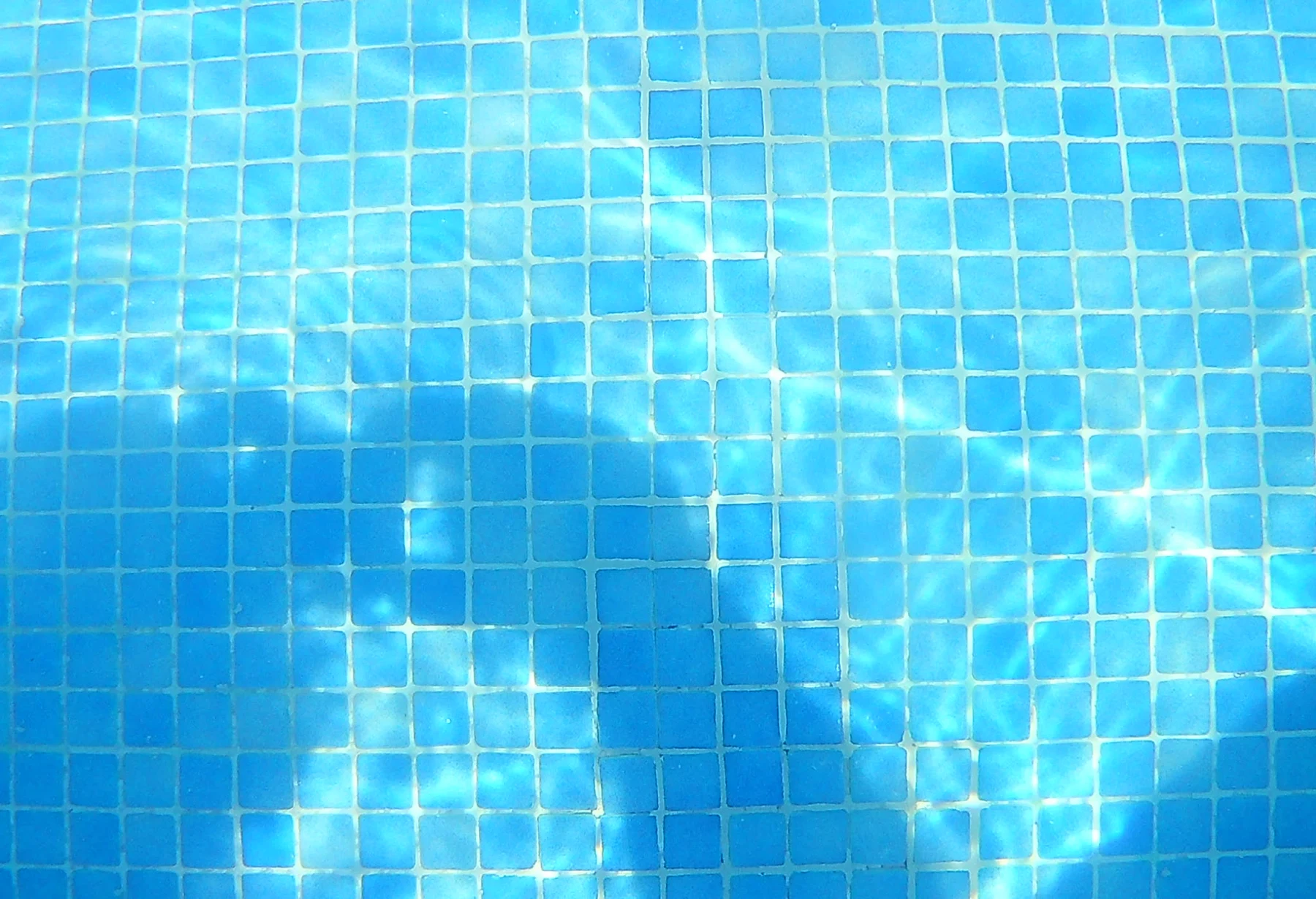 Completed blue mosaic tile repair photographed underwater